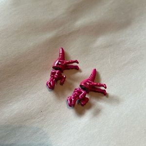 Pink dinosaur kid’s earrings.